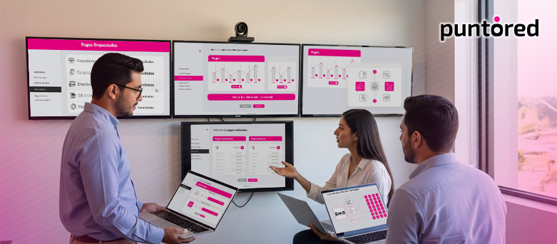 Equipo de tesorería gestionando dispersión de pagos empresariales con dashboards financieros y monitoreo en tiempo real